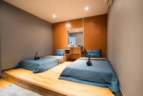 Postel nebo postele na pokoji v ubytování bamboo homestay M2 小竹林 仙本那 榻榻米独栋房源六间房间独立卫生浴 步行码头十分钟