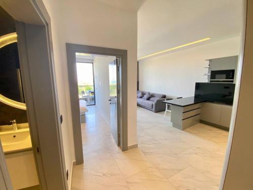 a living room with a couch and a table at Via Mar Residence - Alanya Experience in Alanya
