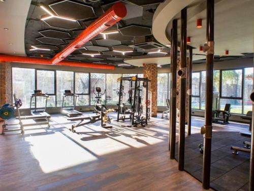 a gym with several treadmills and machines in a room at Via Mar Residence - Alanya Experience in Alanya