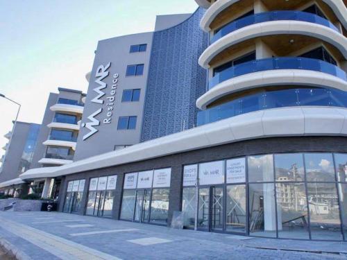 a building with a sign on the side of it at Via Mar Residence - Alanya Experience in Alanya