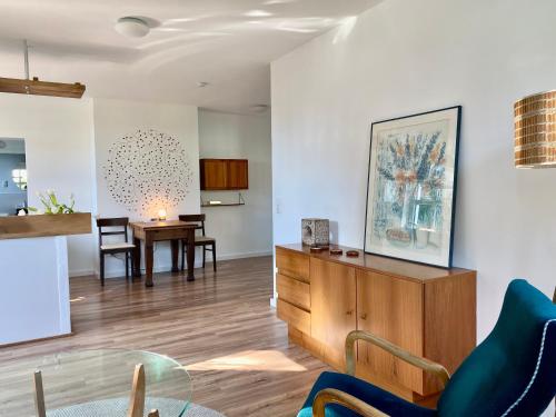 a living room with a table and a dining room at Gronocottage in Bad Harzburg