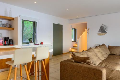a living room with a couch and a table at Villa Thilia in Meganisi