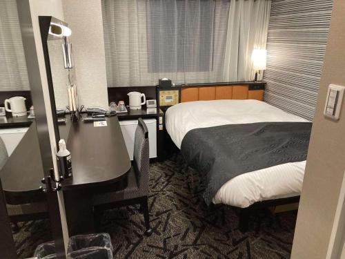 Cama o camas de una habitación en APA Hotel Beppu Ekimae