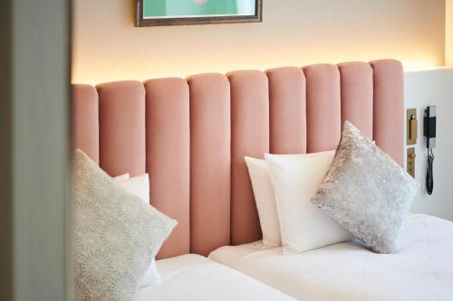 Ein Bett oder Betten in einem Zimmer der Unterkunft Cross Hotel Sapporo