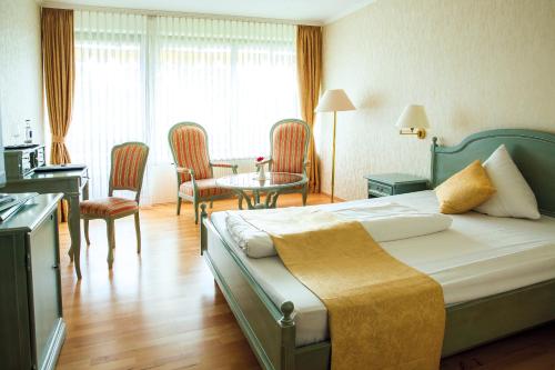 Ένα ή περισσότερα κρεβάτια σε δωμάτιο στο Parkhotel Maasberg GmbH