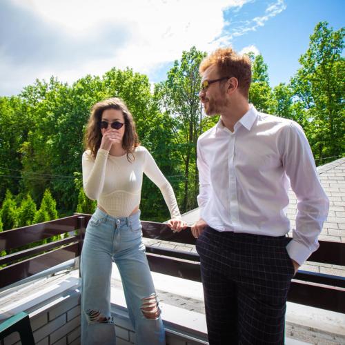 a man and a woman standing on a bridge at Hotel Danica in Vrnjačka Banja