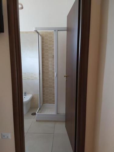 a bathroom with a shower and a toilet and a sink at Agriturismo Il Casale del Cavaliere in Sant'Agata de' Goti