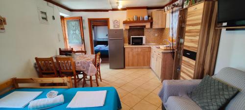 a living room with a kitchen and a dining room at Dalis House in Astris