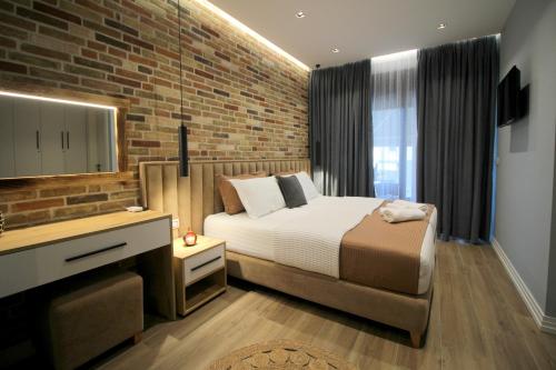 מיטה או מיטות בחדר ב-Ngjela Apartments