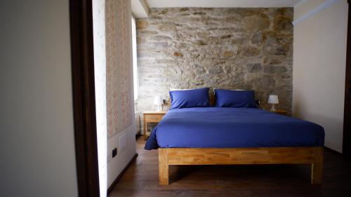 Кровать или кровати в номере La Dimora nel Borgo