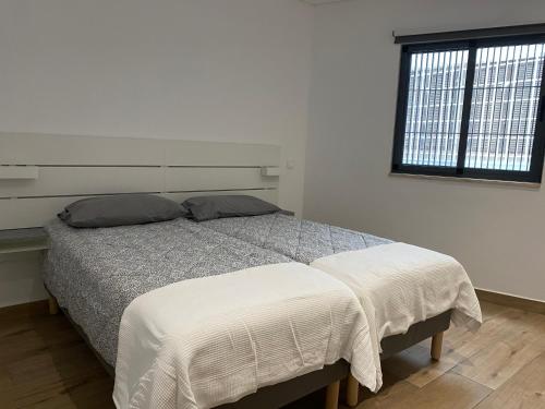 En eller flere senge i et værelse på Sea Views Apartments Gamboa