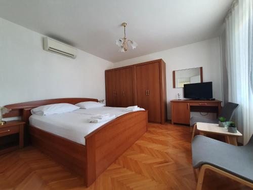 Postel nebo postele na pokoji v ubytování Apartments Lonza