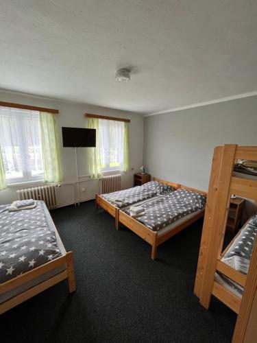Postel nebo postele na pokoji v ubytování Pension Martinské údolí - dependance