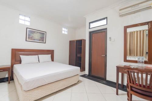 Katil atau katil-katil dalam bilik di RedDoorz Plus at Buah Batu