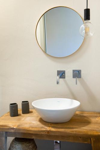 a bathroom with a white sink and a mirror at Casale delle Lavande in Citta' Sant'Angelo