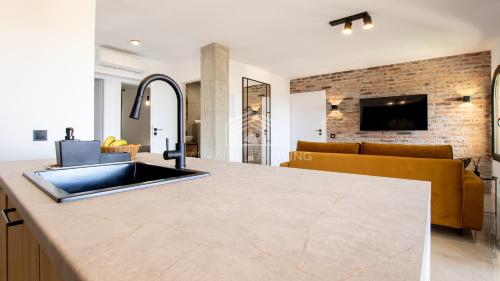Contemporary loft style apartment with amazing sea views and with direct access to the beach from the community