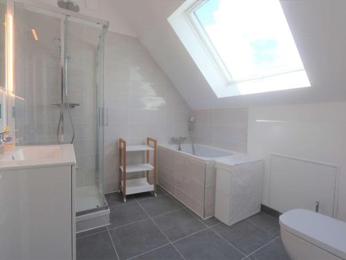 a bathroom with a shower and a sink and a toilet at Maison rénovée 3 étoiles à 150m de la plage, idéale pour familles avec espace enfants et Wifi - FR-1-481-116 in Bénodet