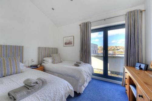 Ένα ή περισσότερα κρεβάτια σε δωμάτιο στο The Penthouse