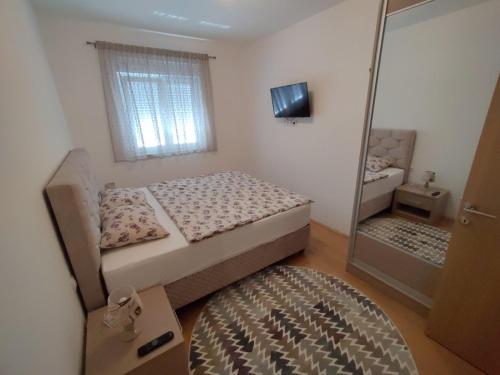 Llit o llits en una habitació de Apartment Tara