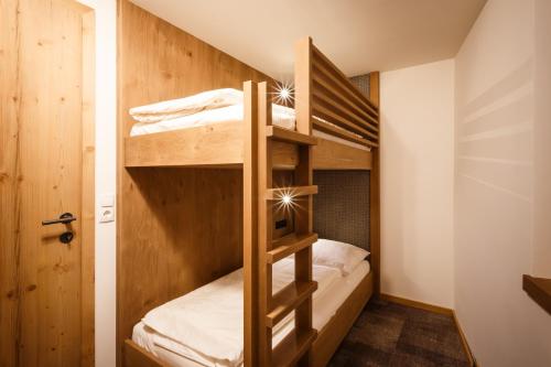 Postel nebo postele na pokoji v ubytování Das Naturhotel die Eng