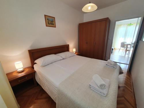 Postel nebo postele na pokoji v ubytování Apartments Lonza