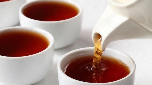 a person pouring coffee into cups of tea at Park House B&B in Leeds