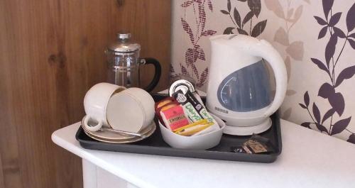 a tray with food and a blender on a table at Park House B&B in Leeds