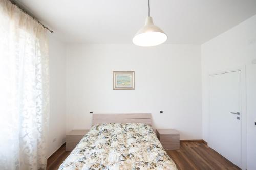 Postel nebo postele na pokoji v ubytování Casa Vacanze Raggio Di Sole