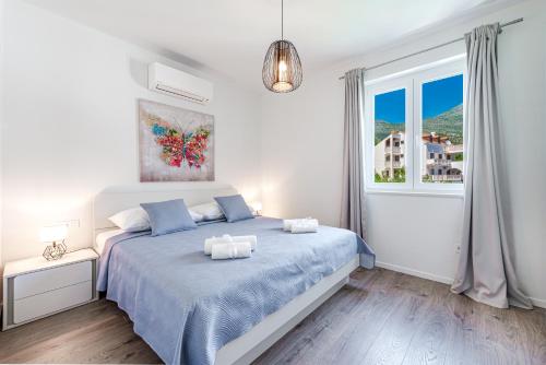Posteľ alebo postele v izbe v ubytovaní Amazing Sea View Apartments Petra & Paula