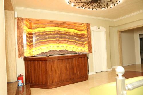 a large painting on a wall in a room at Hotel Autostrada (Highway) in Kashari