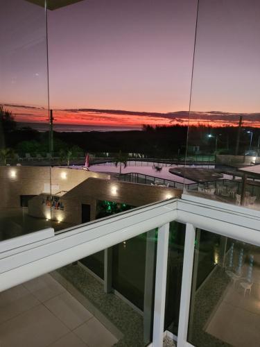 a view from the balcony of a building at night at Apto Le Bon Vivant Vista Mar in Arraial do Cabo