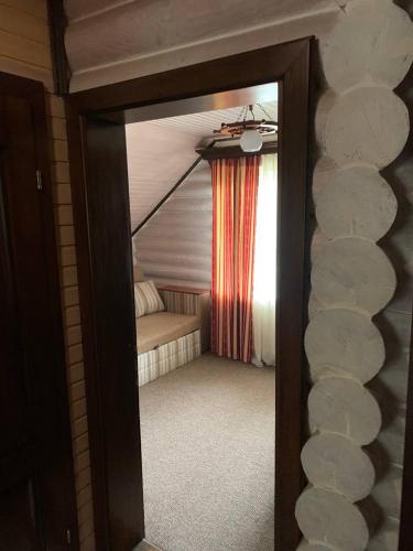 a room with a bed and a window with a curtain at Готель Жди ня Єво instagram zhdenievo hotel in Zhdenievo