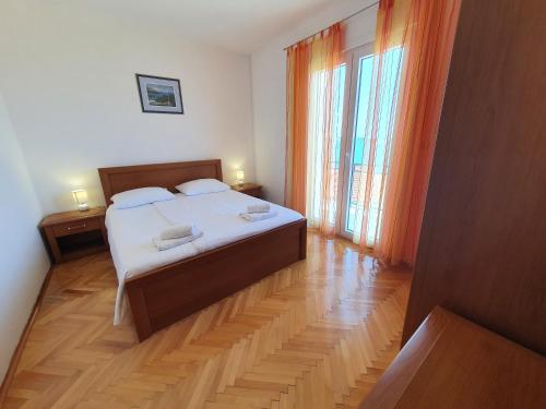 Postel nebo postele na pokoji v ubytování Apartments Lonza