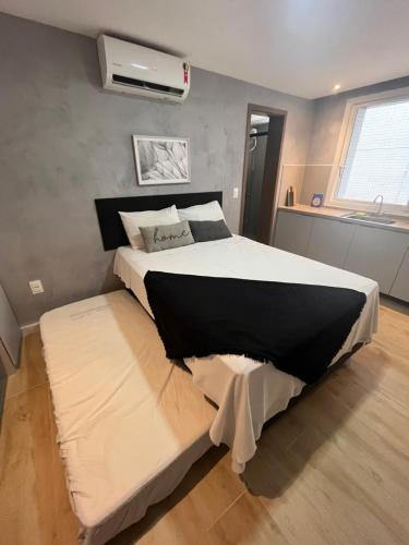 מיטה או מיטות בחדר ב-Flat 313 Bauten Cabo Branco