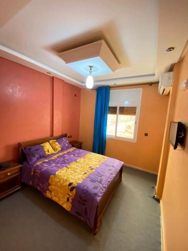 En eller flere senger på et rom på Hotel Achokre