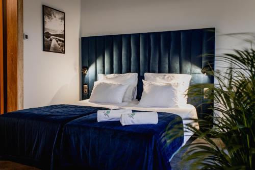 Katil atau katil-katil dalam bilik di Natural Hotel w Rezerwacie z Plażą Na Wyspie