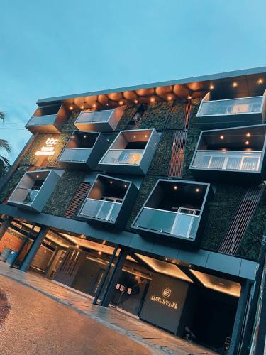 a building with many windows on the side of it at BBC Luxury Apartments in Perintalmanna