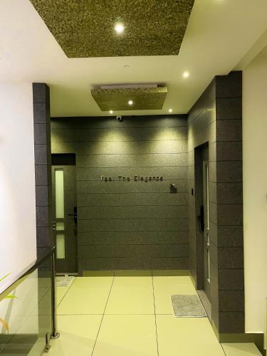a wall with a sign that reads for the bathroom at BBC Luxury Apartments in Perintalmanna