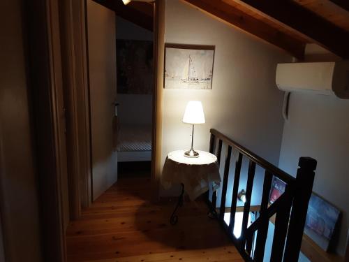 a lamp sitting on a table in a hallway at Dioni Villa in Sivota