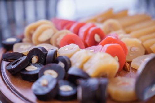 a pile of different types of food on a plate at Pavlo Napa Beach Hotel in Ayia Napa