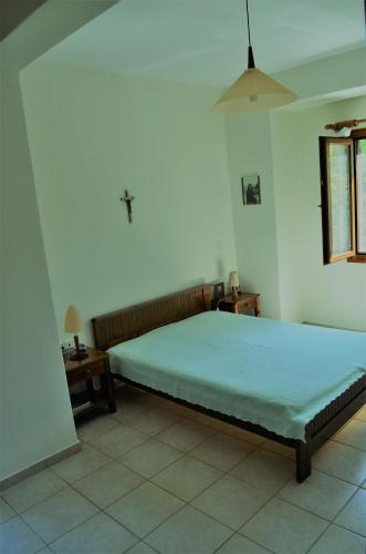 a bedroom with a large bed in a room at Villa skopelos in Skopelos Town