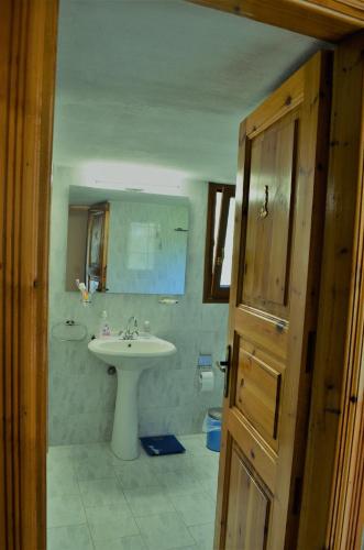 a bathroom with a sink and a mirror at Villa skopelos in Skopelos Town