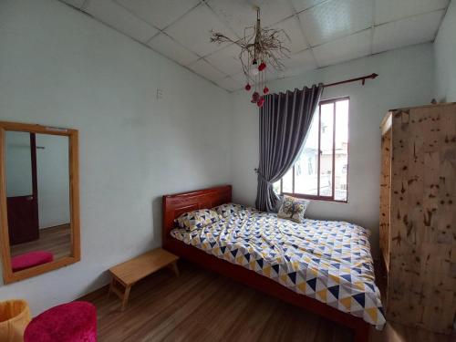 Postel nebo postele na pokoji v ubytování Homestay HoLo