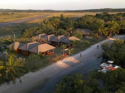 an aerial view of a resort with a river at Inhaca Kanimambo Lodge in Canhamba