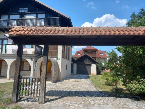 a wooden walkway in front of a house at Apartman Sadija in Sarajevo