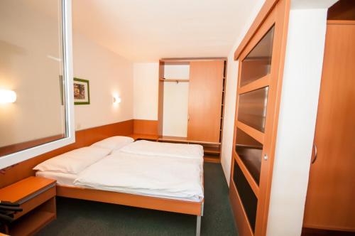 Ένα ή περισσότερα κρεβάτια σε δωμάτιο στο Hotel Agava