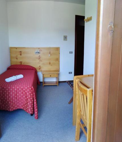 Cama ou camas em um quarto em Hotel Saint Nicolas Gran Paradiso