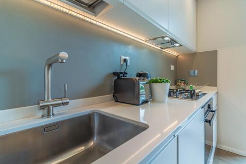 Kuchyň nebo kuchyňský kout v ubytování CASA BRIGITTE Comfort, Vista e Parcheggio