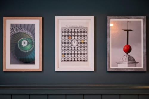 three framed pictures of a computer on a wall at The Mitre by Innkeeper's Collection in London