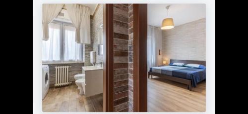 una camera con letto e una camera con bagno di Queen East Verona apartments a Verona